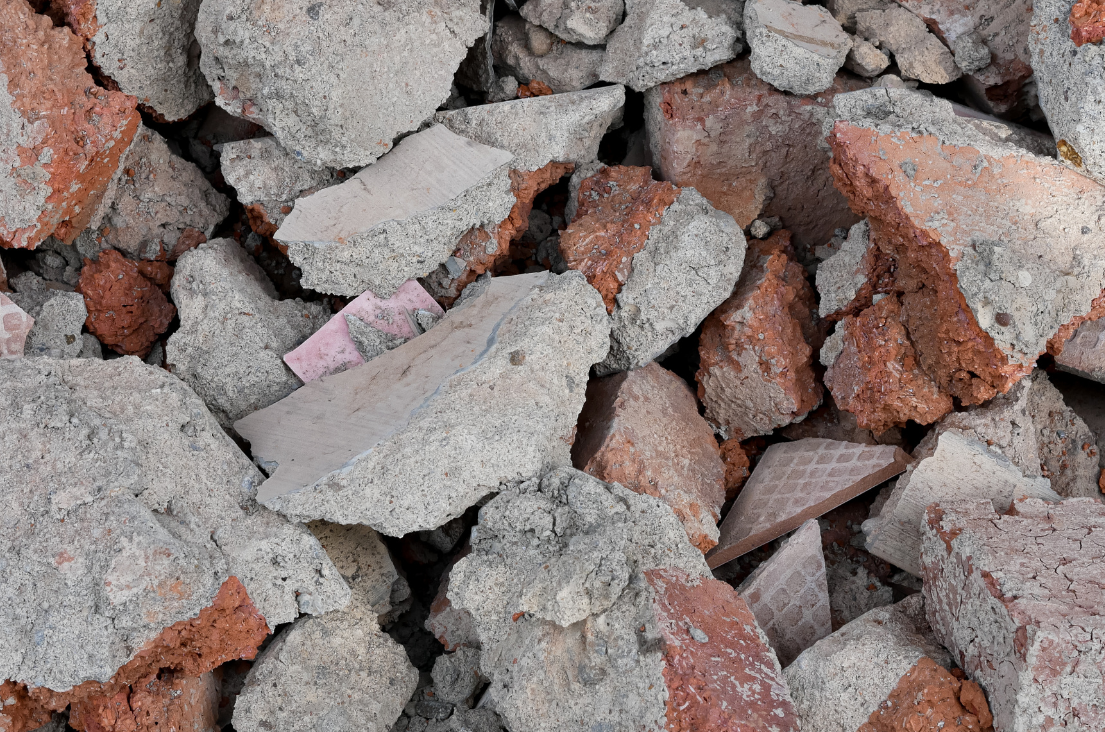 Excavating & Grading Services Muskego WI - Close-up view of a pile of broken concrete and red bricks.